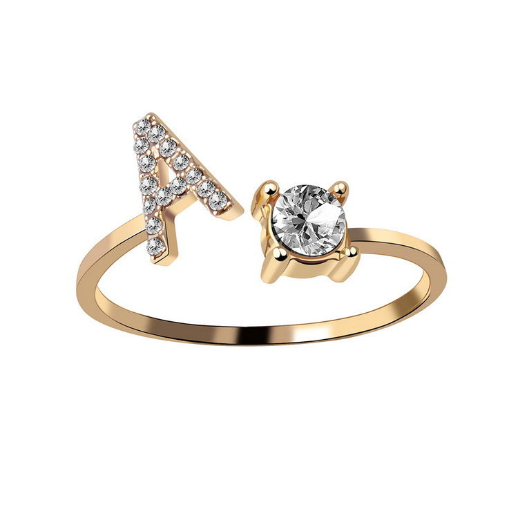 Gold adjustable initial letter ring with round crystal and crystal-set letter