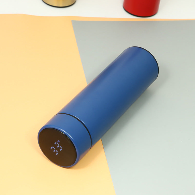Blue insulated vacuum bottle with LED temperature display on dark end cap