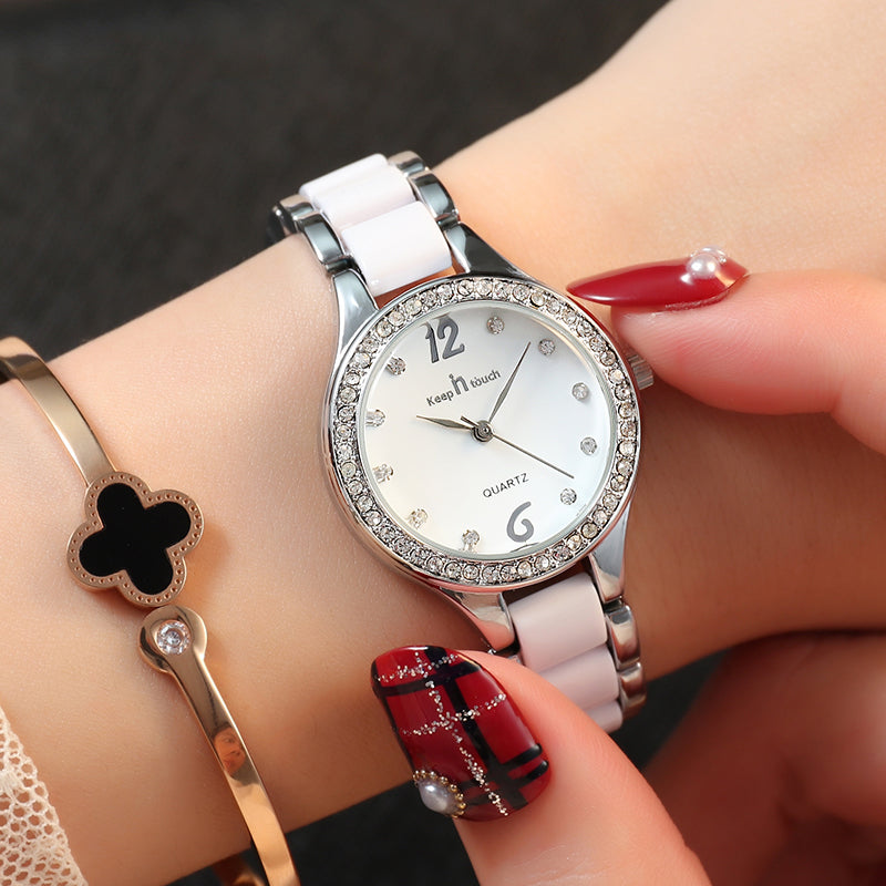 Women quartz wrist watch with white dial, silver bezel, white metal bracelet