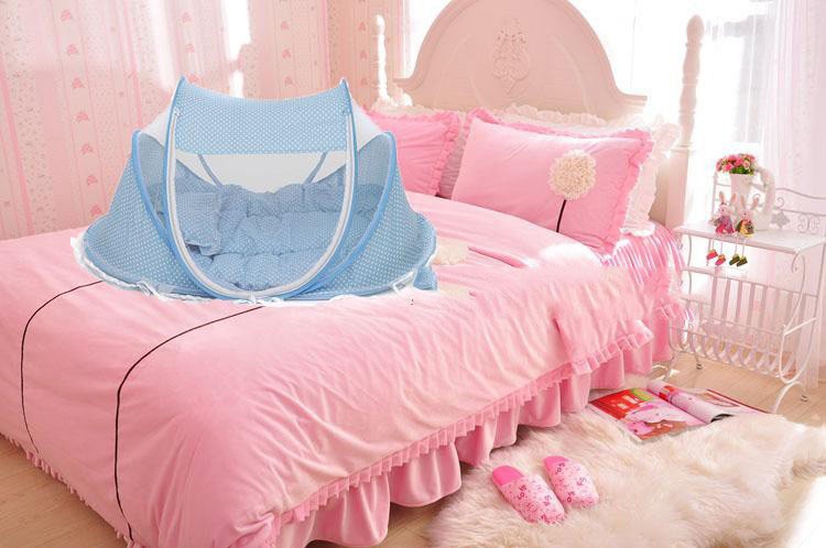 Foldable baby bed net set in blue dotted fabric, arched mesh canopy with pillow insert