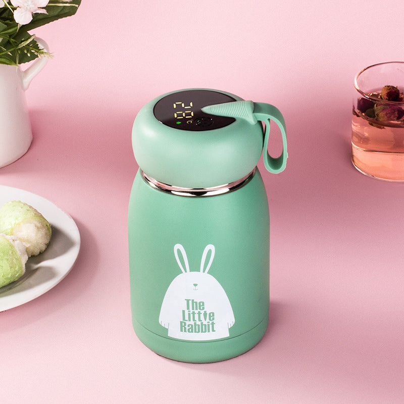 Green insulated thermos bottle with digital temperature display and rabbit graphic