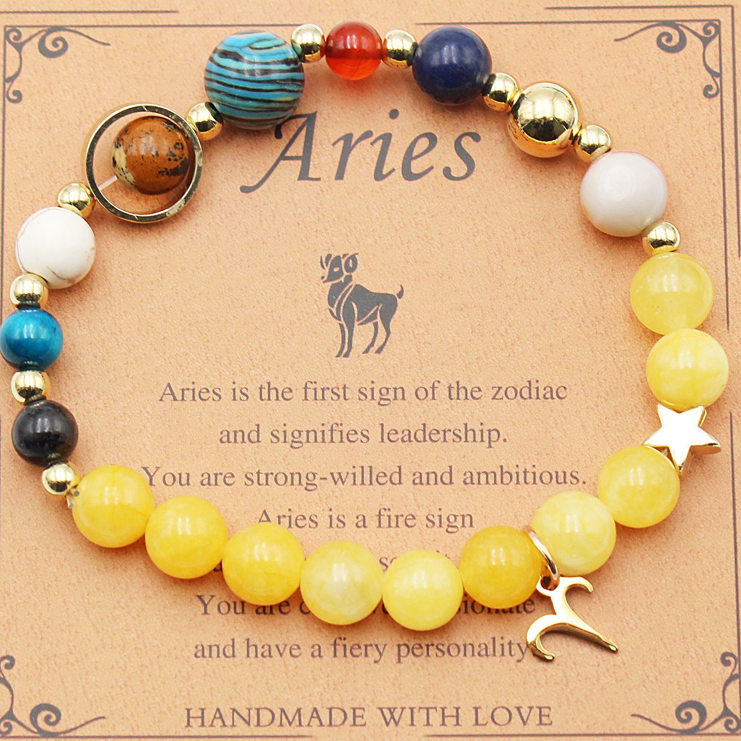 Beaded zodiac bracelet with yellow beads, gold spacers, star charm and ram-shaped charm