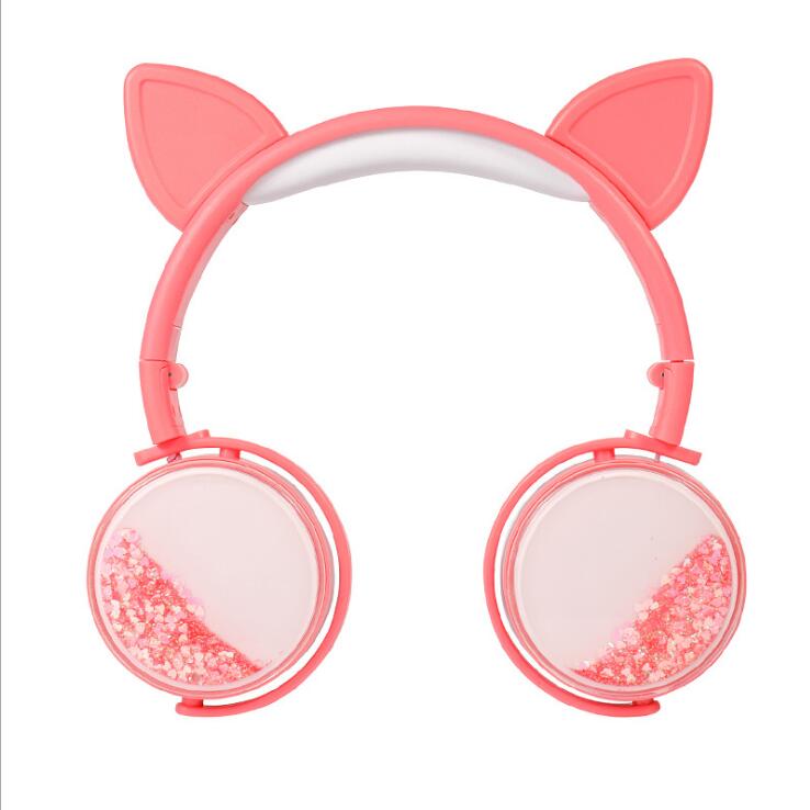 Pink cat-ear headphones with round ear cups and pink glitter speaker windows