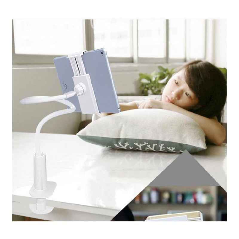 White 360-degree spiral tablet stand with flexible arm beside a bed