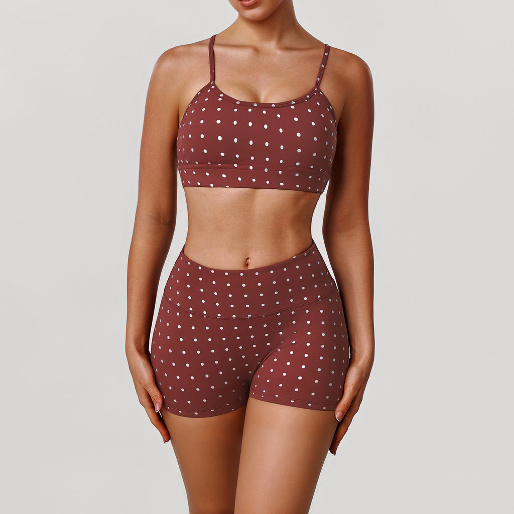 Women’s rust red sports bra and shorts set with white dot print, thin straps