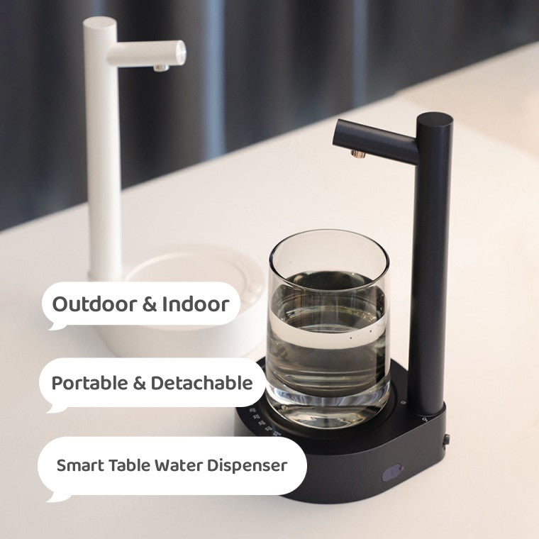 Electric water dispenser with white stand and spout, glass cup under water outlet