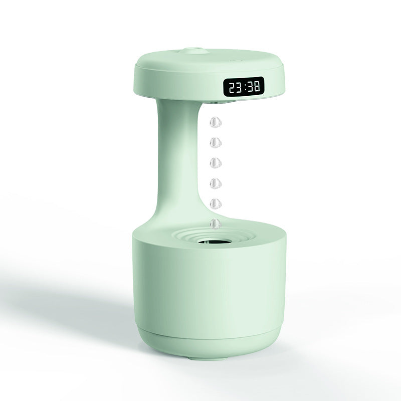Green cool mist humidifier with LED clock display and suspended water droplets.