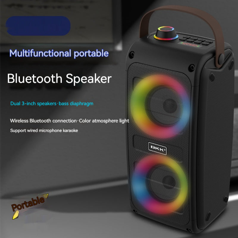 Black portable Bluetooth speaker, angled view, dual woofers with color light glow.