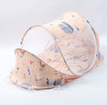 Foldable baby bed net set in beige with multicolor print, arched mesh canopy and pillow insert