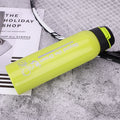 Bike water bottle in lime green with black flip cap
