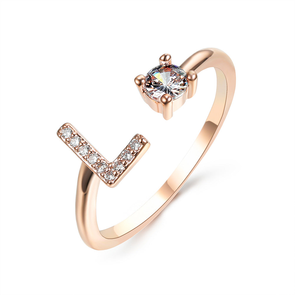 Rose gold initial letter ring with pavé rhinestones and round center crystal