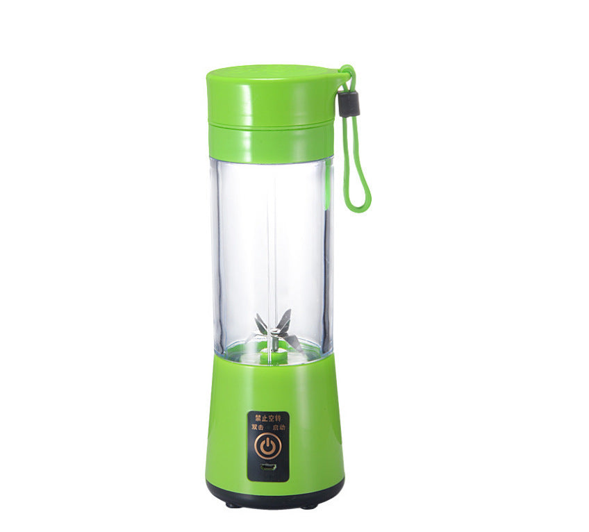 Green portable electric fruit juicer with clear blending cup and green lid