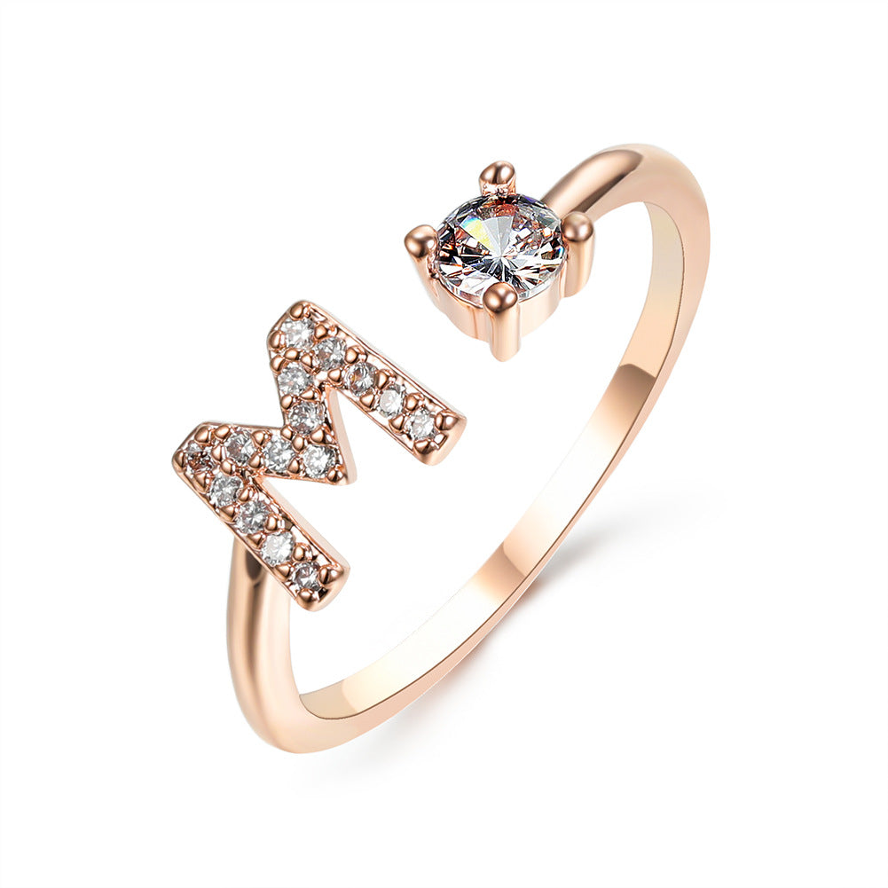 Rose gold initial letter ring with pavé rhinestones and round center crystal
