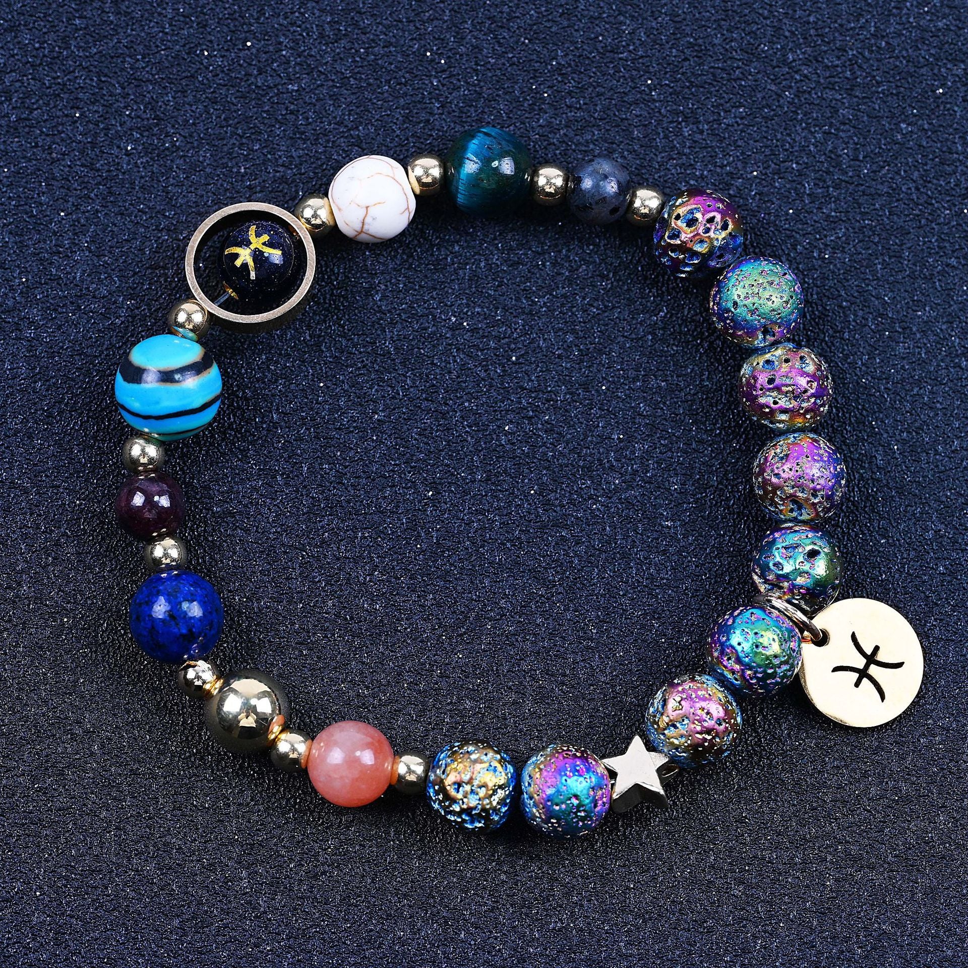 Beaded bracelet with blue beads, striped bead, rainbow speckled beads, star charm, zodiac disc.