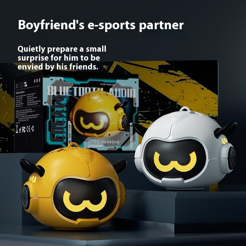 Two mini Bluetooth speakers: yellow and white robots with cartoon face and horn speakers