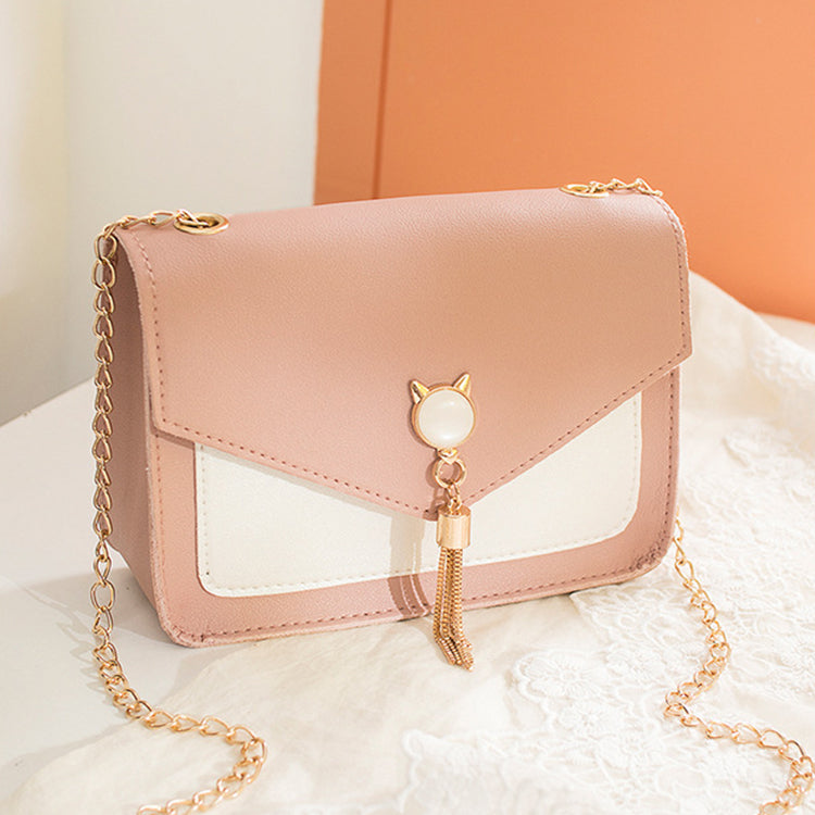 Small messenger bag, blush pink with white insert, cat charm and gold tassel clasp