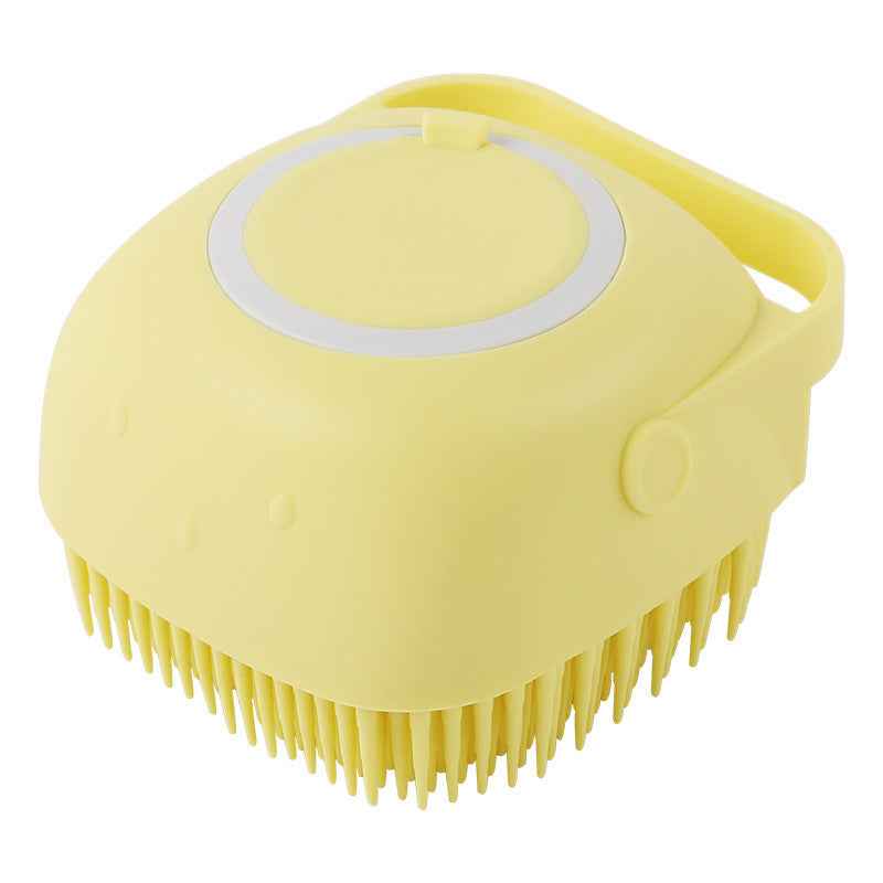 Yellow silicone pet grooming brush with oval massage pad and short bristle tips