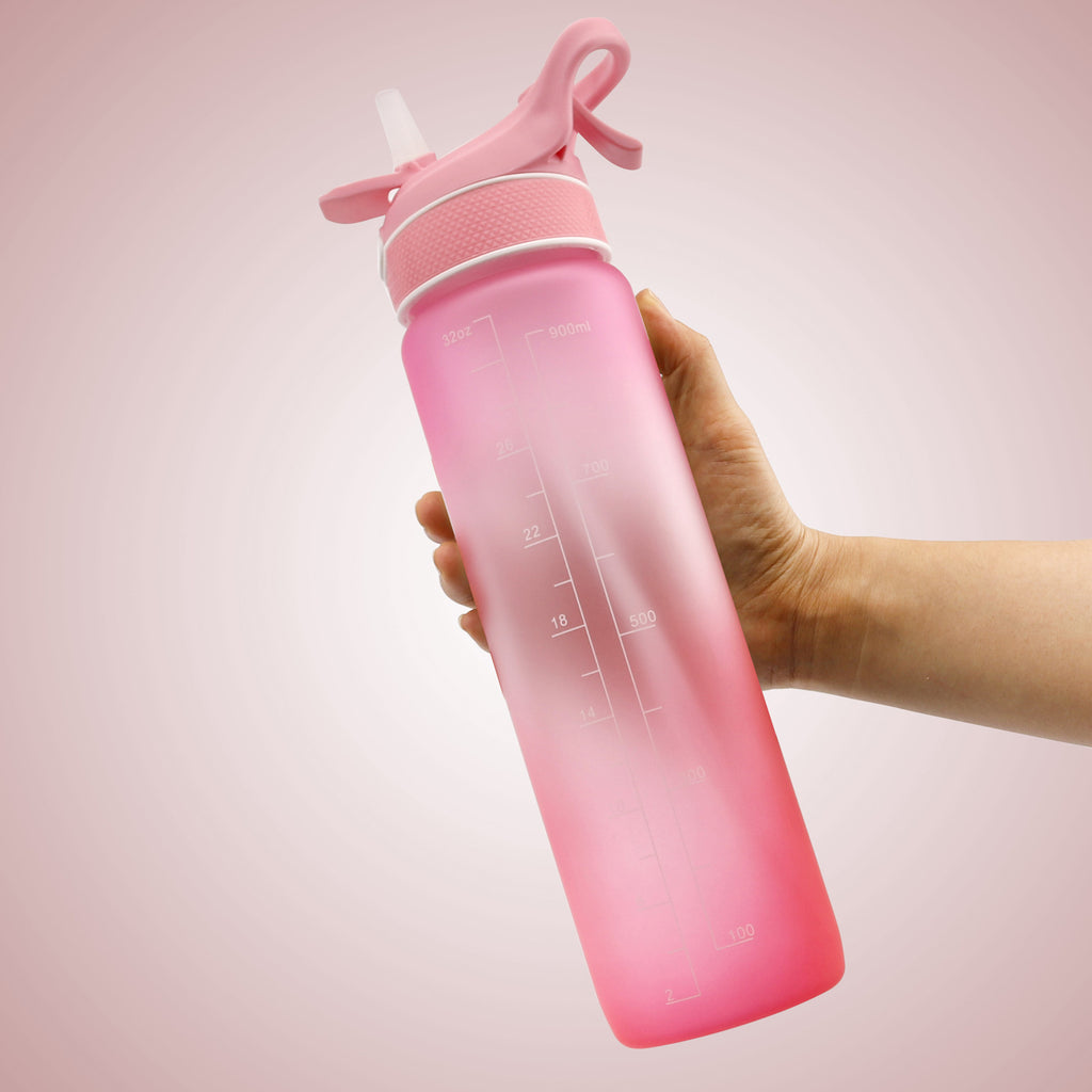 Water bottle with flip straw cover, pink gradient, printed hydration timing and refill text.