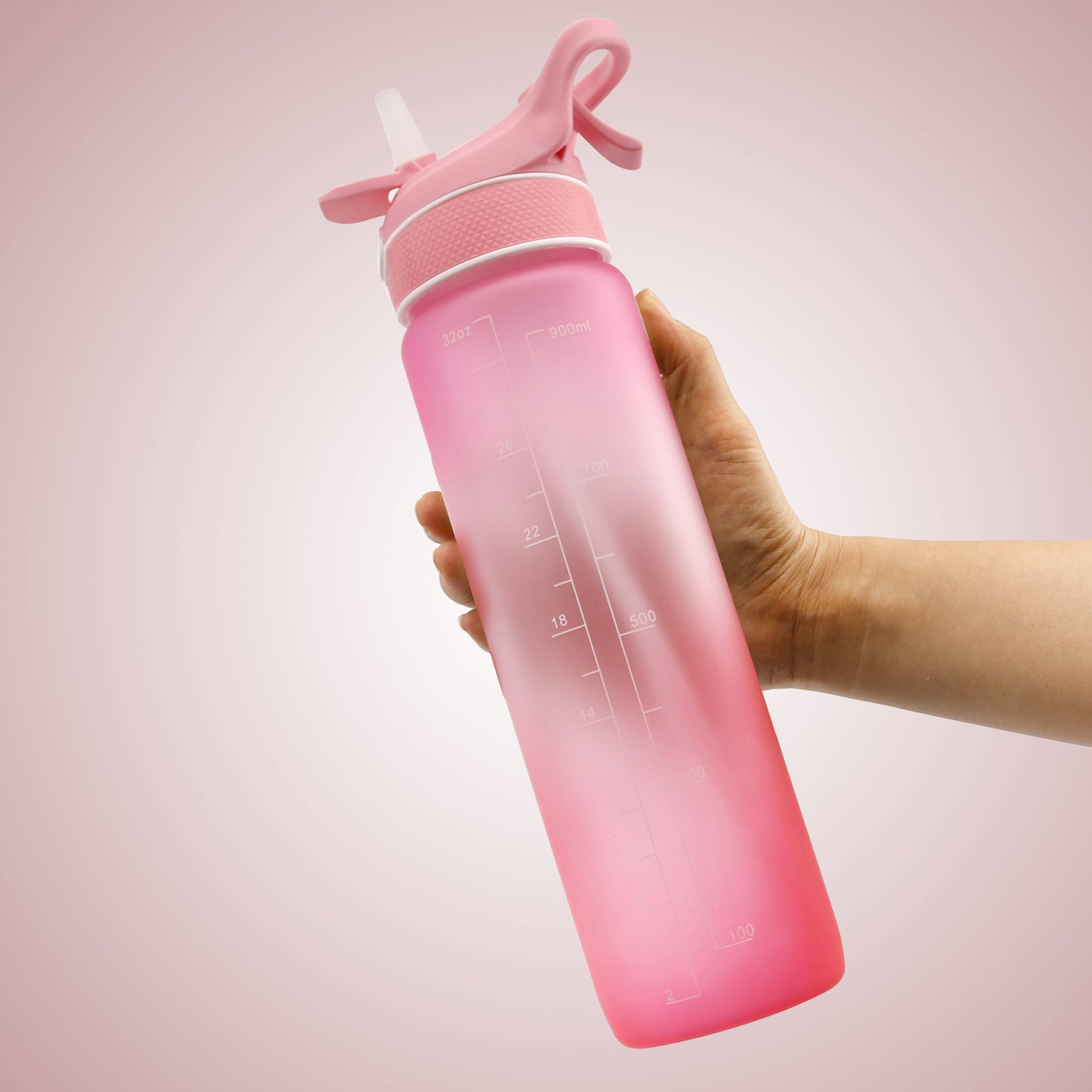 Water bottle with flip straw cover, pink gradient, printed hydration timing and refill text.