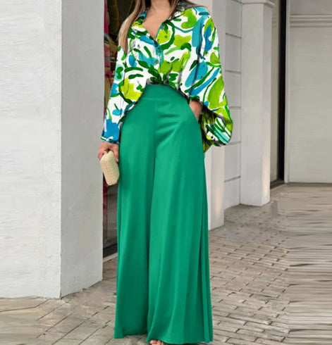 Printed shirt top with bold green patterns and green wide-leg pants