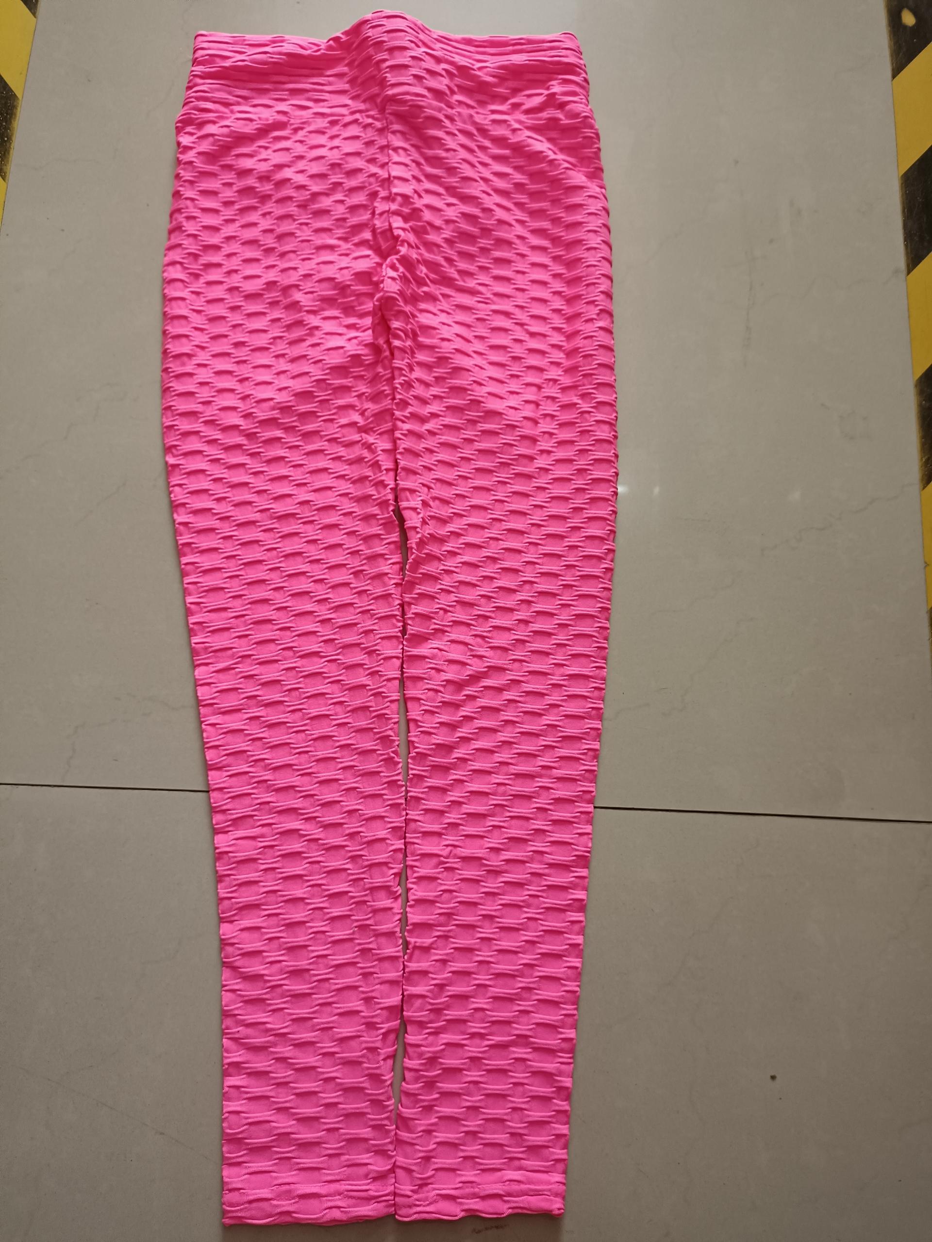 Hot pink scrunch leggings with textured lift pattern, full-length view