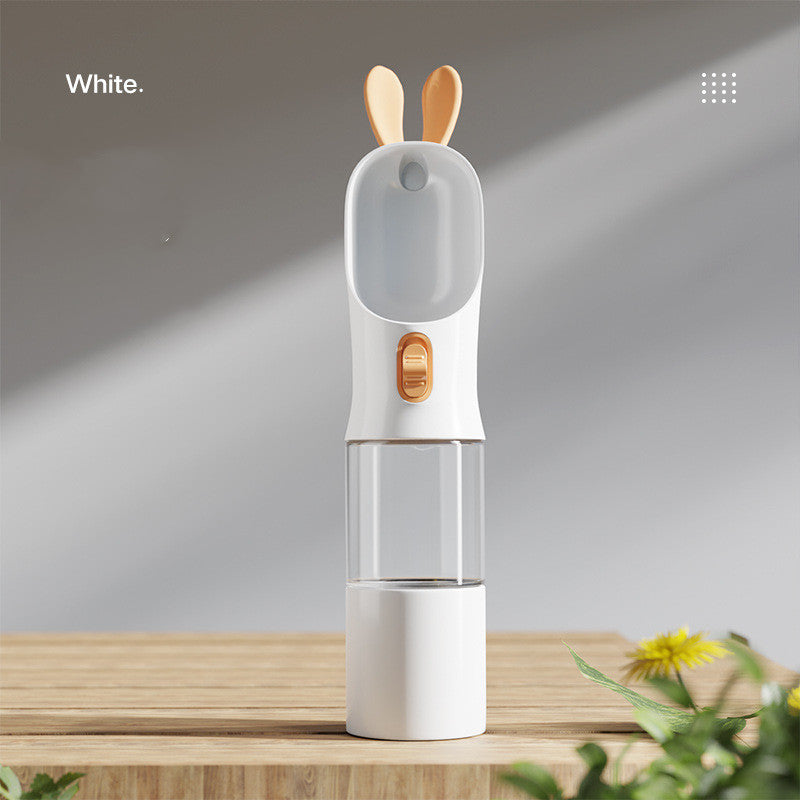 Pet water travel bottle in white; clear chamber with white bottom