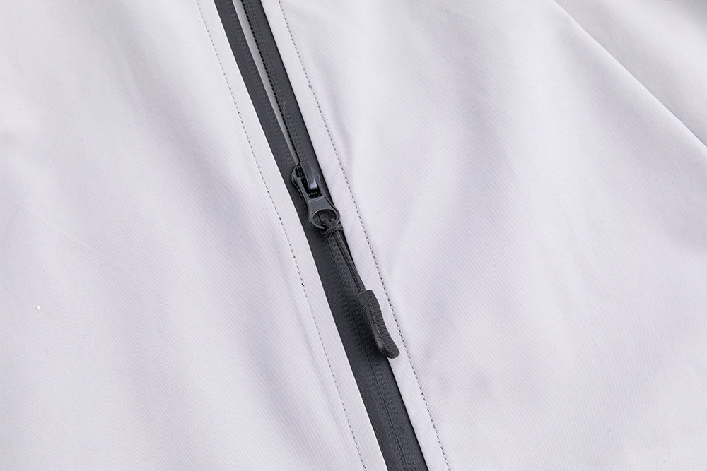 Assault suit jacket front zipper detail on white shell