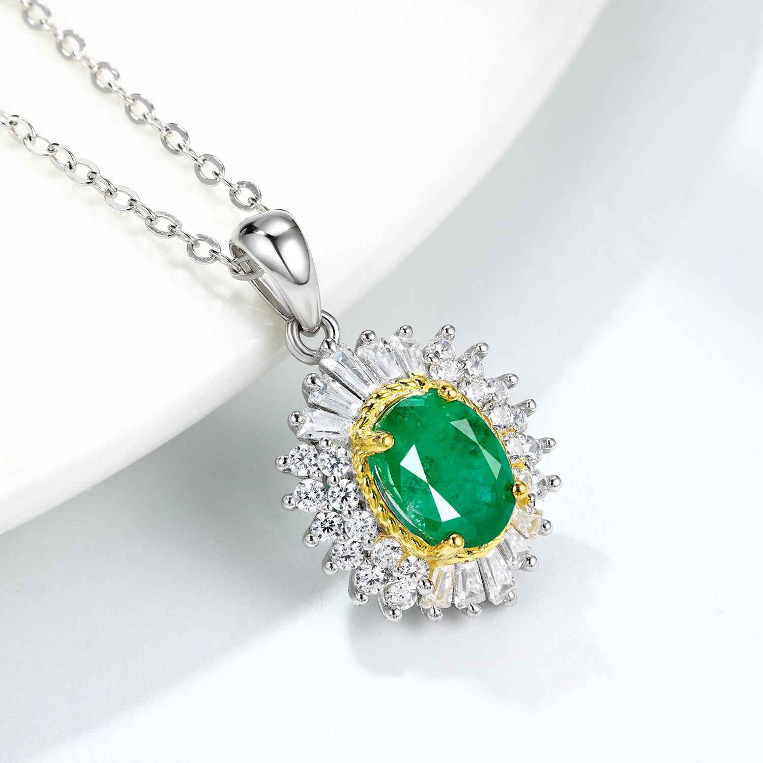 Silver pendant necklace with oval green gemstone, gold bezel, crystal halo