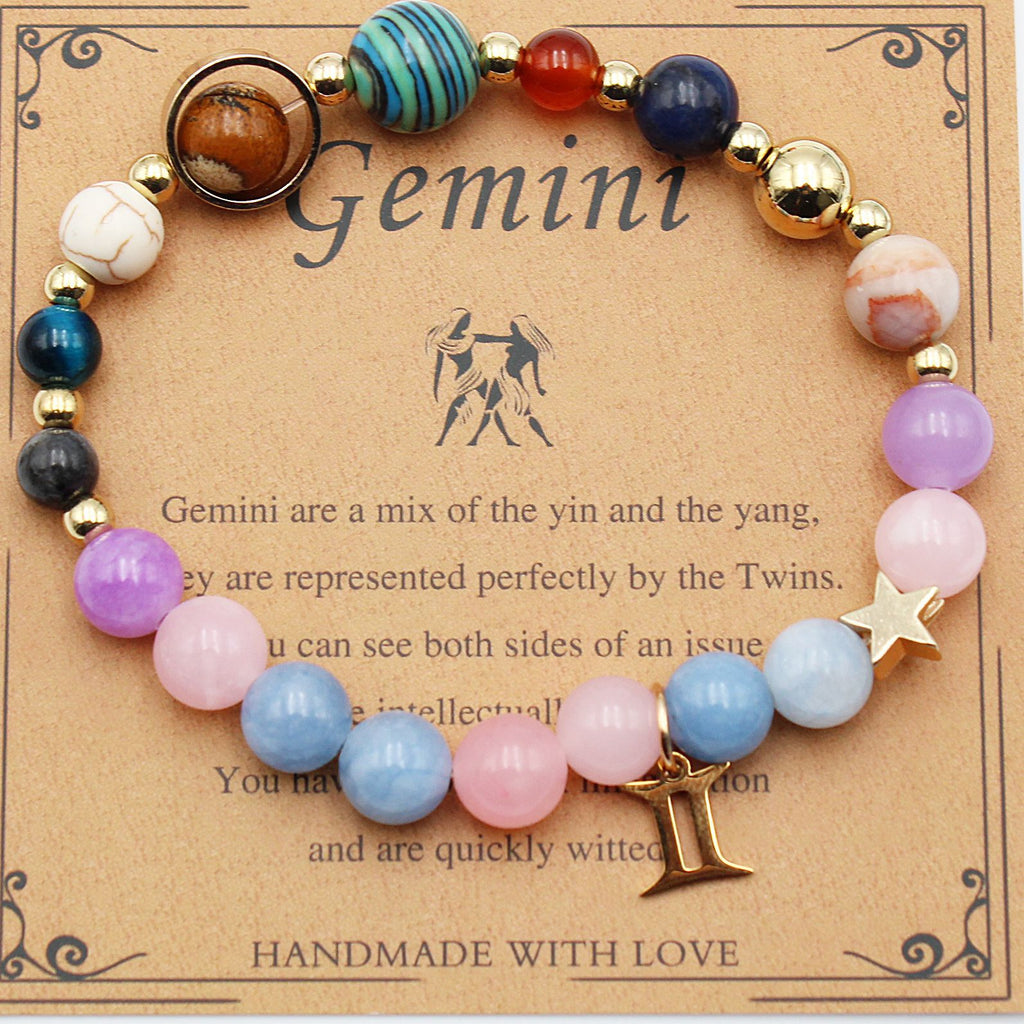 Gemini zodiac beaded bracelet with pastel pink, blue, and purple beads
