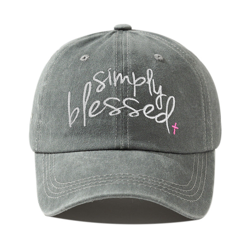 Light gray-green washed baseball cap with embroidered "Simply Blessed" script