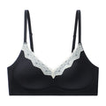 V-neck lace seamless bra, black flat lay with white lace V-neck trim and adjustable straps