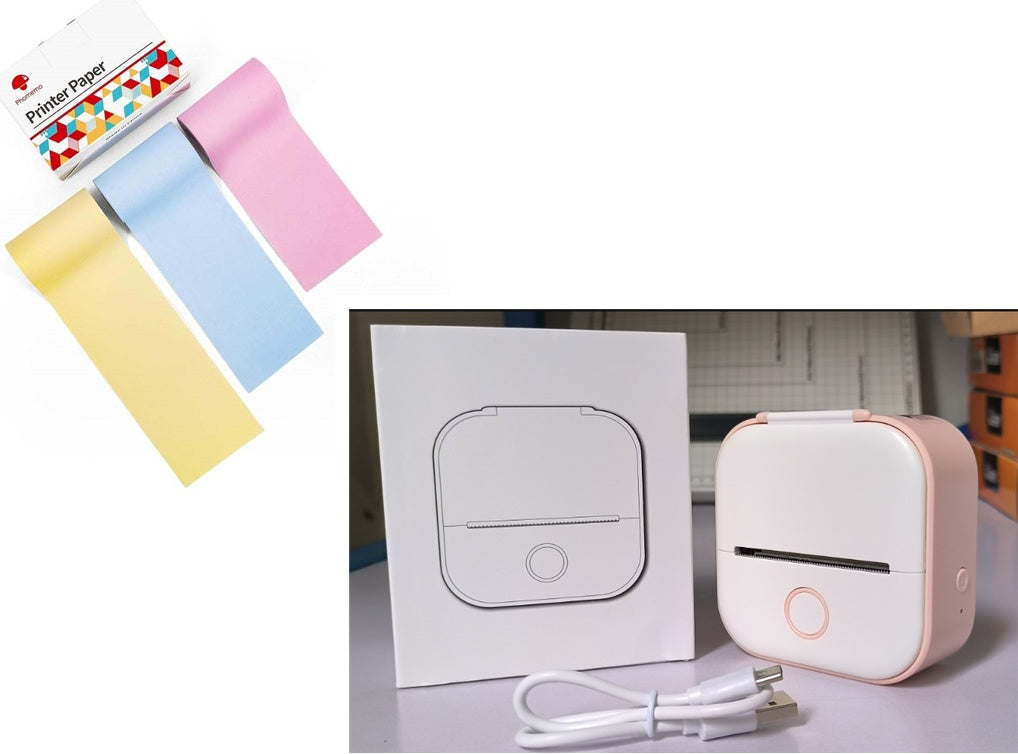 Portable mini thermal label printer with white body and pastel paper roll accessories